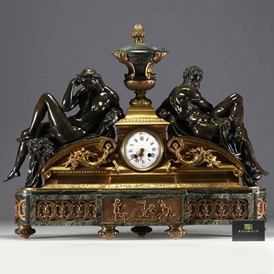 Imposing ormolu and patinated mantel clock decorated with antique figures, marble base, 19th century.