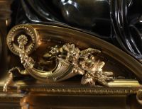 Imposing ormolu and patinated mantel clock decorated with antique figures, marble base, 19th century.