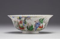 China - Porcelain bowl decorated with frieze of characters, mark in red under the piece.