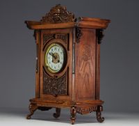 Carved exotic wood clock in the style of Gabriel Viardot with chinoisant decoration, elephant head feet, 19th century.