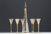 Elegant carafe in cut glass enhanced with gold and eight glasses.