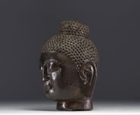 Asie - Tête de Bouddha en pierre sculptée.