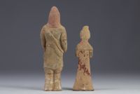 China - Two polychrome terracotta statues in the form of figures, from the Tang period (618-907).