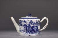 China - A white and blue porcelain teapot decorated with landscapes and a junk, 18th century.