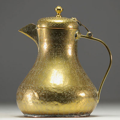 Persian coffee pot in chased brass with animal and figure motifs.