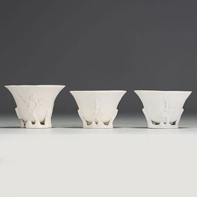 China - Set of three white porcelain libatory bowls.