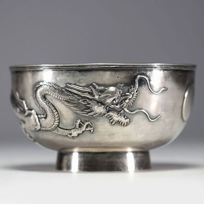 China - Large solid silver bowl decorated with dragons in relief.