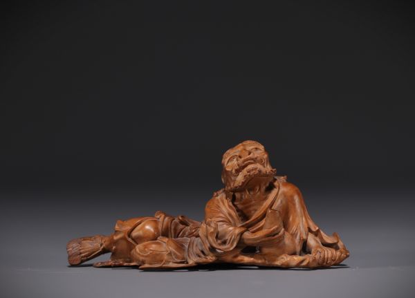 Japan - Boxwood sculpture of a reclining old man, late 19th century.