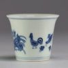 China - White-blue porcelain cup decorated with a rooster and hens.