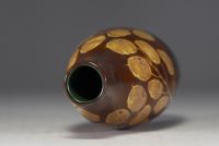 Charles CATTEAU (1880-1966) KERAMIS - Enamelled stoneware vase decorated with papal coins on a brown and green background, signed.