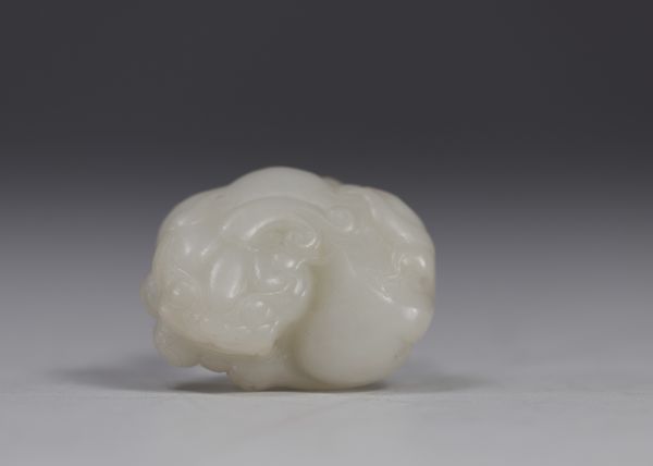 China - White jade carved with Shi Shi decoration, Qing period.