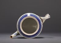 China - A white and blue porcelain teapot decorated with landscapes and a junk, 18th century.