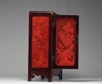 China - Hardwood cabinet inlaid with cinnabar panels, 19th century.