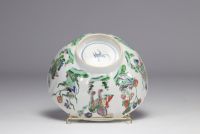 A porcelain bowl decorated with flowers and dogs with a mark under the piece, Kangxi period (1661-1722)