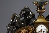 Imposing ormolu and patinated mantel clock decorated with antique figures, marble base, 19th century.