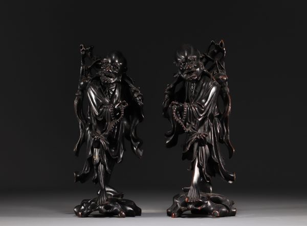 China, Vietnam - Pair of exotic wood carvings representing two figures.