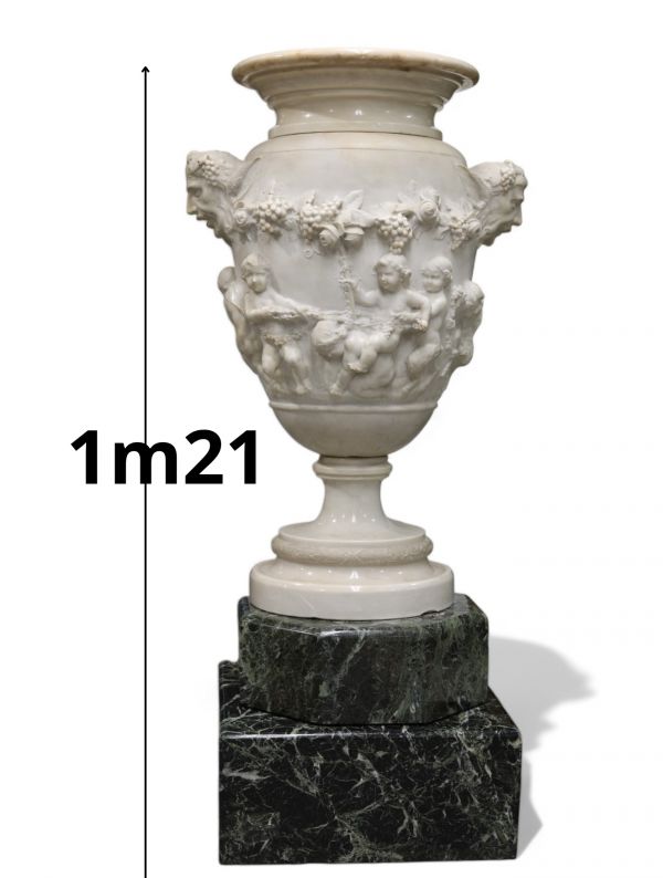 Imposing Carrara marble urn decorated with Satyrs and Putti in the Clodion style, first half of the 18th century.