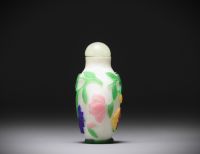 China - Snuffbox in multi-layered glass with floral decoration on a white background