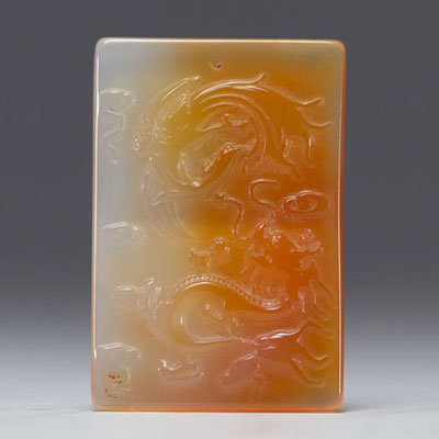 China - Agate plaque with carved decoration of a dragon and a phoenix.