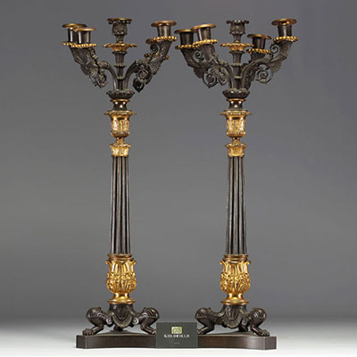 Pair of ormolu and patinated candelabras with four arms and a central covered light, tripod base, Charles X period.