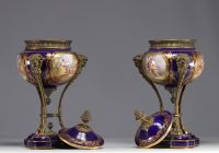 Pair of Sèvres porcelain cassolettes decorated with gallant scenes, mounted on bronze.