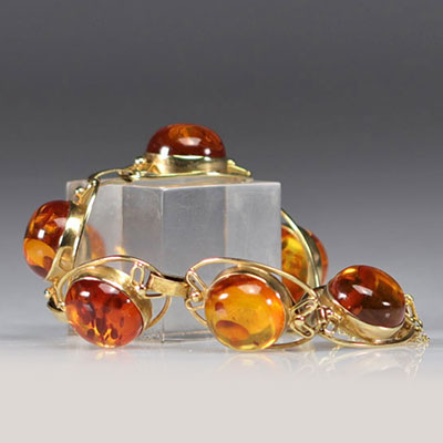 Gold bracelet with several amber links