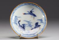 Chine - Ensemble de quatre bols et assiettes en porcelaine polychrome à décor floral et canards.18eme