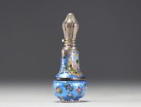 A rare silver and guilloché enamel salt flask decorated with flowers and landscape scenes, 19th century.