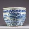 China - A white-blue porcelain fish tank with landscape decoration, the upper part decorated with a frieze of ruyi.