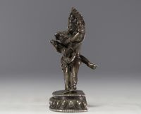 China - Tibet - Silver statue of Vajrapani embracing Shakti.