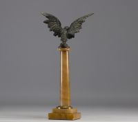 Watch and thermometer holder on marble column surmounted by an eagle in regula, late 19th century.