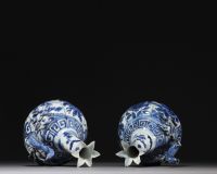 China - Pair of blue-white porcelain jugs with floral decoration, Wanli, Ming dynasty.