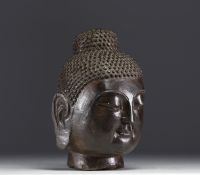 Asie - Tête de Bouddha en pierre sculptée.