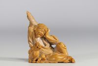 China - Hard stone sculpture of a figure with a lion on a wooden base.