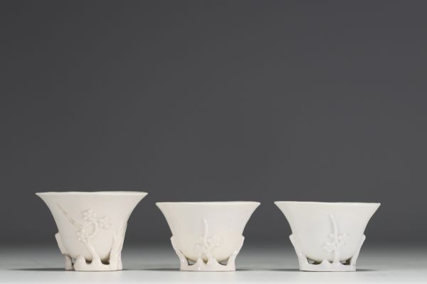 China - Set of three white porcelain libatory bowls.