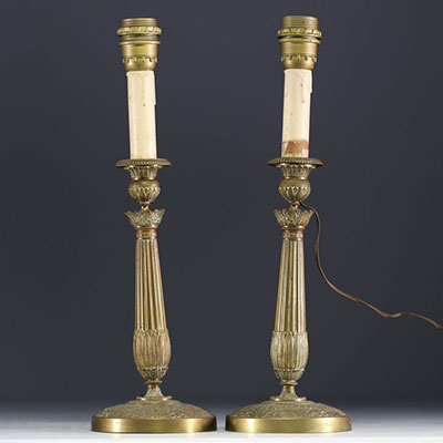 A pair of bronze candlesticks in the Restoration style, 19th century.