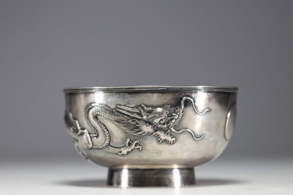 China - Large solid silver bowl decorated with dragons in relief.