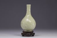 China - Monochrome bottle vase decorated with dragons in relief, Qing period.